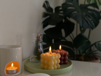 Candles and plants creating a peaceful atmosphere.