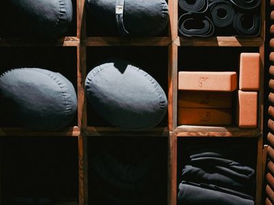 Yoga accessories arranged neatly on a bench.